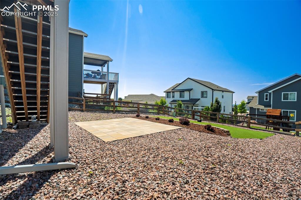 5633 Makalu Drive Colorado Springs, CO 80924 - Photo 43 of 48 a view of a house with a swimming pool and sitting area