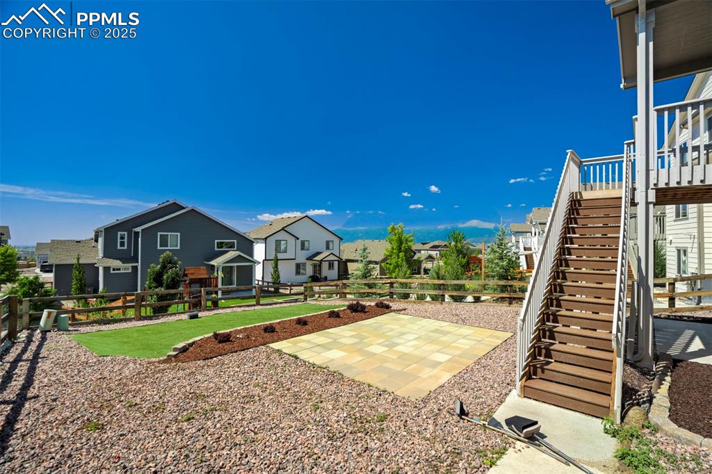 5633 Makalu Drive Colorado Springs, CO 80924 - Photo 46 of 48 a view of a house with a yard