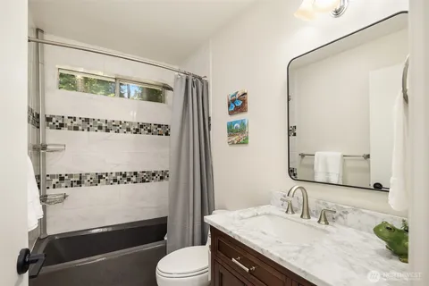 a utility room with sink dryer and washer