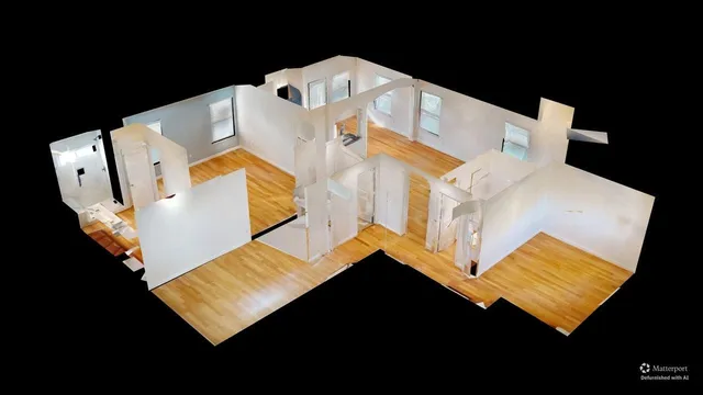 a view of a bed in a white room