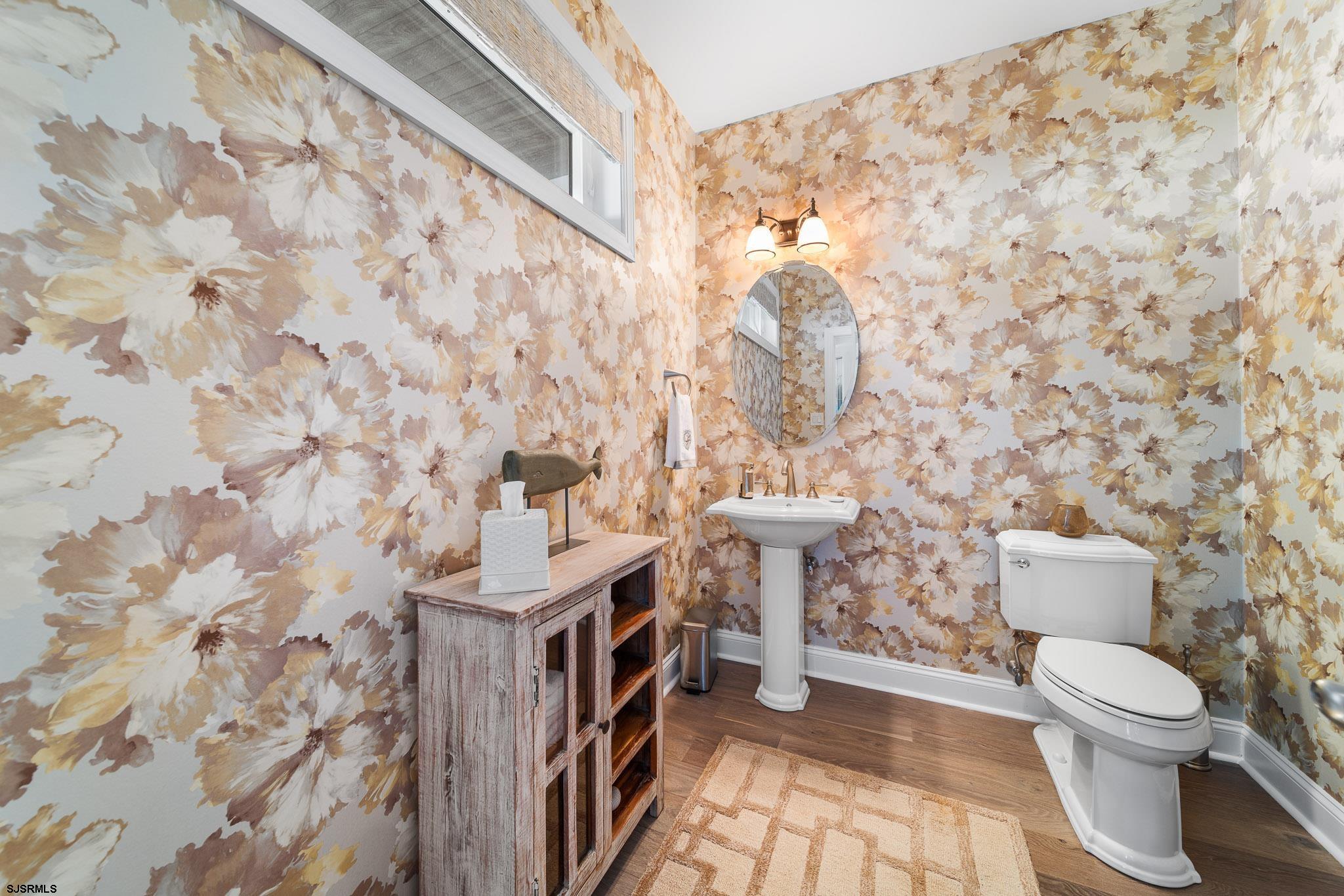 10 Golf Course Drive Brigantine, NJ 08203 - Photo 14 of 56 a bathroom with a toilet and a shower curtain