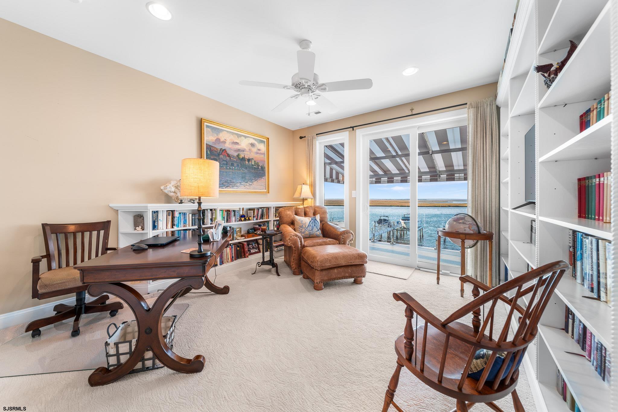 10 Golf Course Drive Brigantine, NJ 08203 - Photo 35 of 56 a view of a livingroom with furniture and a large window