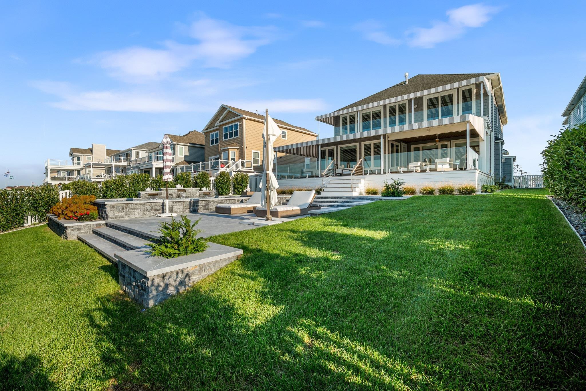 10 Golf Course Drive Brigantine, NJ 08203 - Photo 51 of 56 a front view of a house with a garden