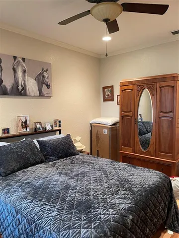 a bedroom with a bed and cabinets