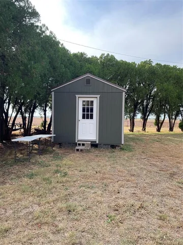 a house with trees in the background