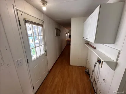 a view of an entryway with wooden floor and stairs