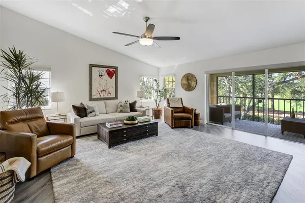 a living room with furniture and a large window