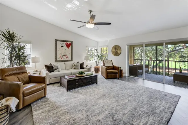 a living room with furniture and a large window
