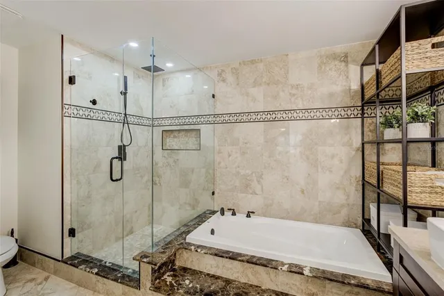 a bedroom with a bed a dresser and a window