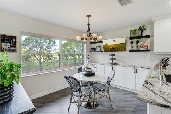 a dining room with furniture and window