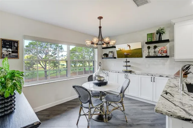 a dining room with furniture and window