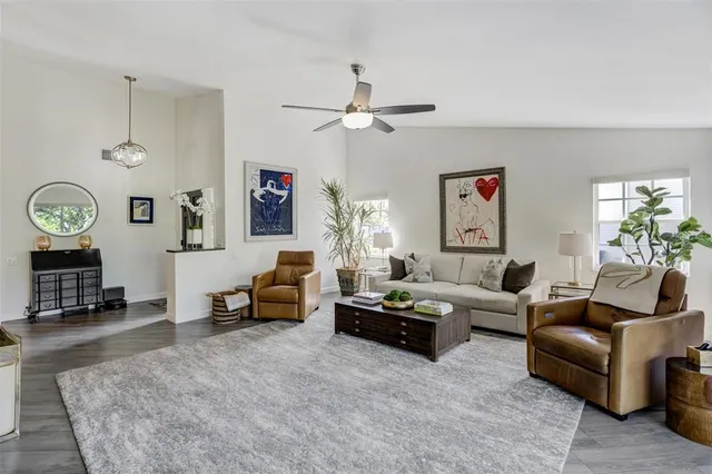 a living room with furniture or couch and a flat screen tv