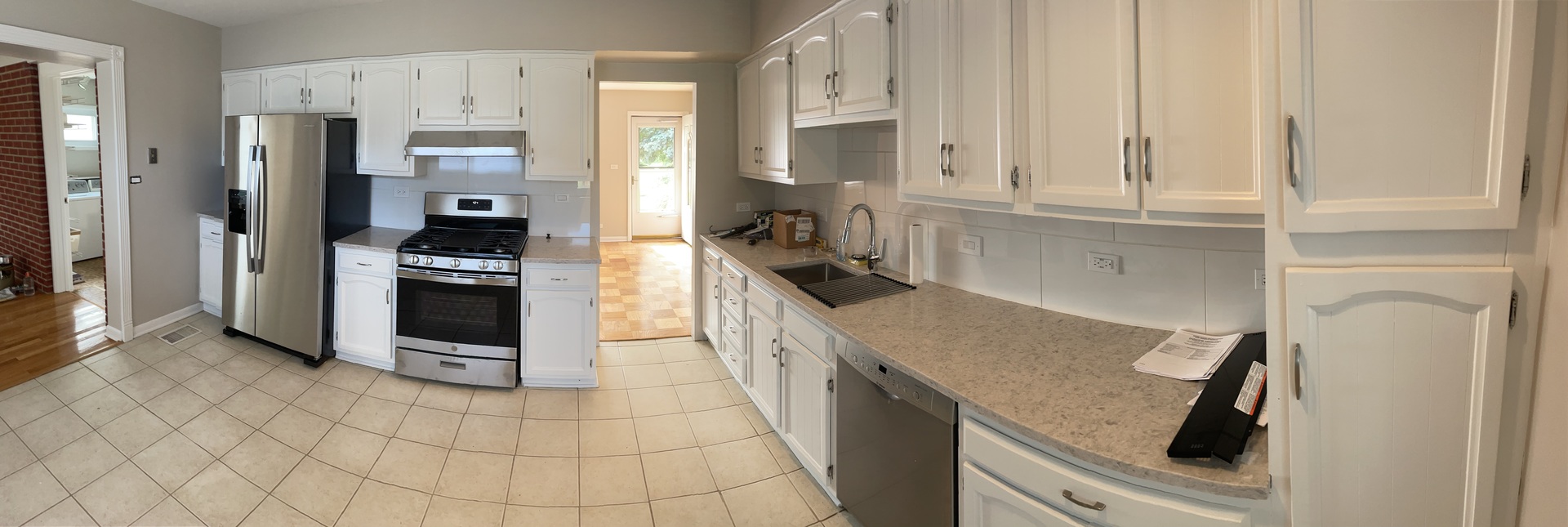 1087 Leahy Circle Des Plaines, IL 60016 - Photo 4 of 9 a kitchen with stainless steel appliances granite countertop a refrigerator and a stove