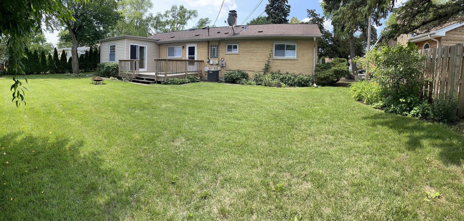 1087 Leahy Circle Des Plaines, IL 60016 - Photo 8 of 9 a view of a house with a yard and sitting area