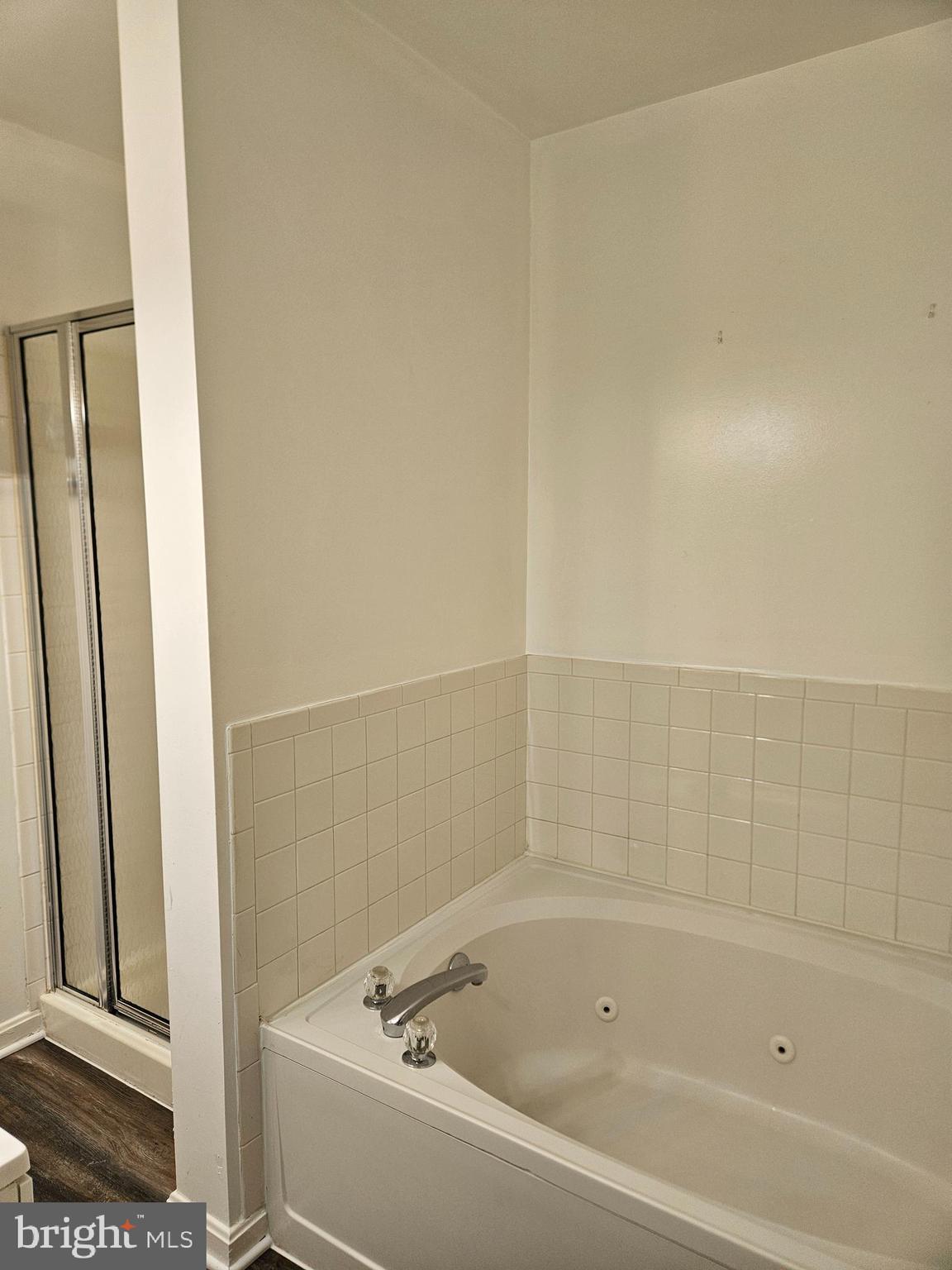2040 Alice Avenue, Unit 2040201 Oxon Hill, MD 20745 - Photo 11 of 15 a bathroom with a bathtub