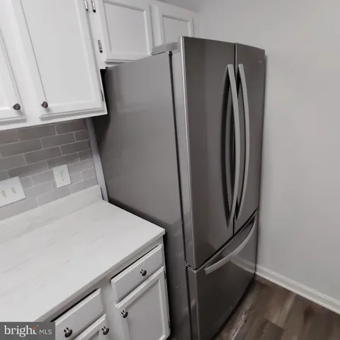 a view of a refrigerator in kitchen