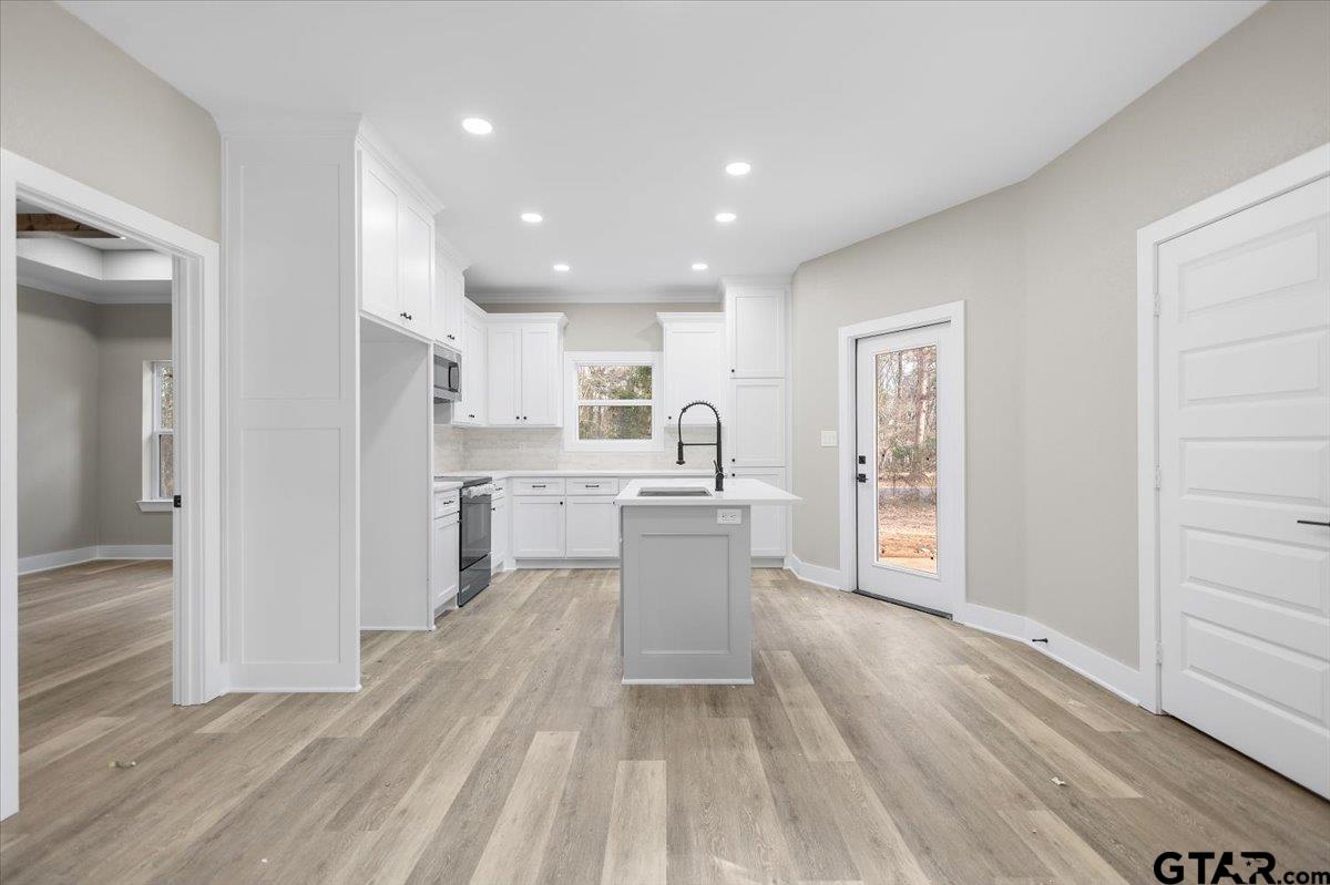 663 Caroline Bend Bullard, TX 75757 - Photo 12 of 36 a kitchen with a refrigerator and a sink