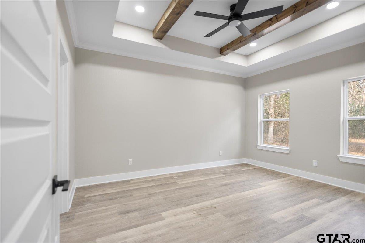 663 Caroline Bend Bullard, TX 75757 - Photo 16 of 36 a view of an empty room with wooden floor and a window
