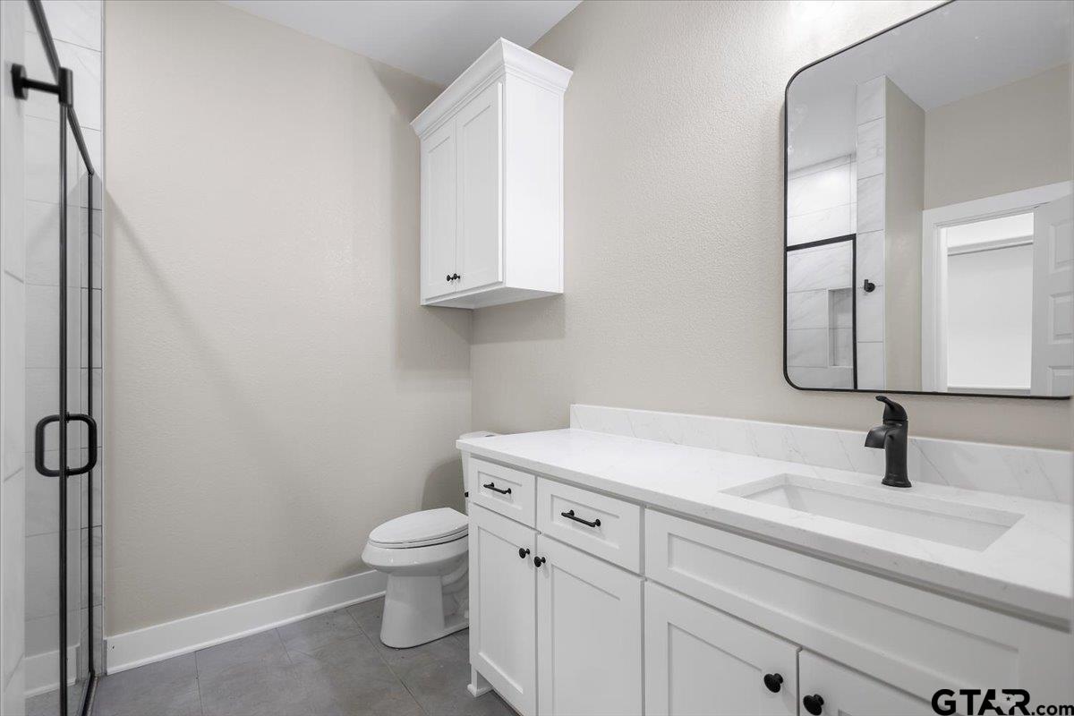 663 Caroline Bend Bullard, TX 75757 - Photo 20 of 36 a bathroom with a sink toilet and vanity