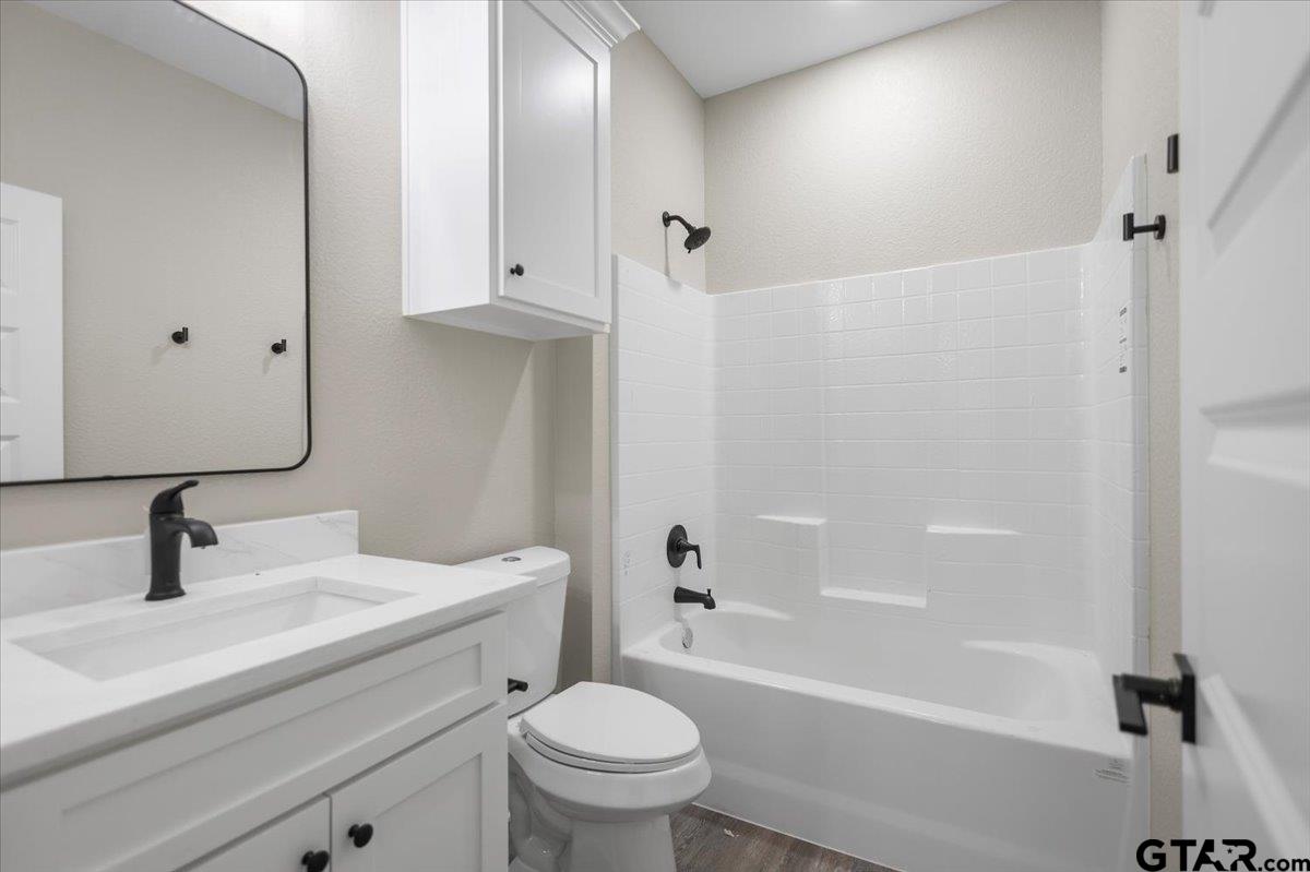 663 Caroline Bend Bullard, TX 75757 - Photo 23 of 36 a bathroom with a sink a toilet and a bathtub