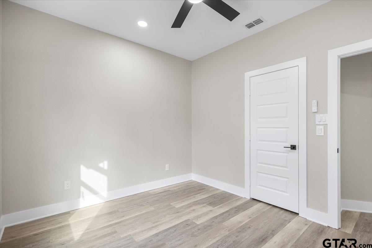 663 Caroline Bend Bullard, TX 75757 - Photo 25 of 36 wooden floor in an empty room