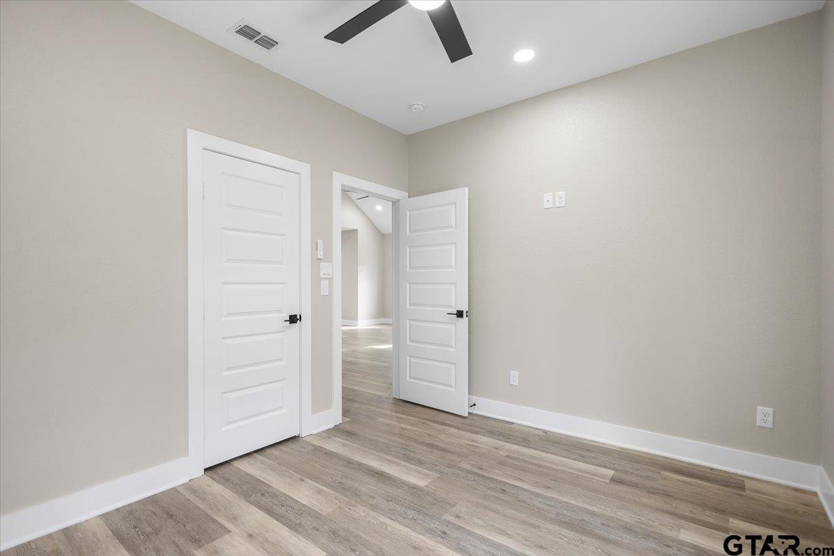 663 Caroline Bend Bullard, TX 75757 - Photo 26 of 36 an empty room with closet and windows