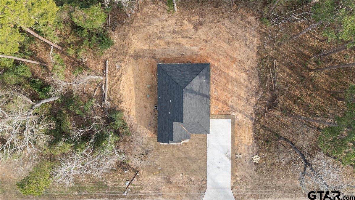 663 Caroline Bend Bullard, TX 75757 - Photo 35 of 36 a brick house with a tree in front of it