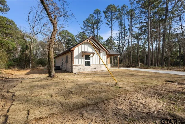 a house with trees in front of it