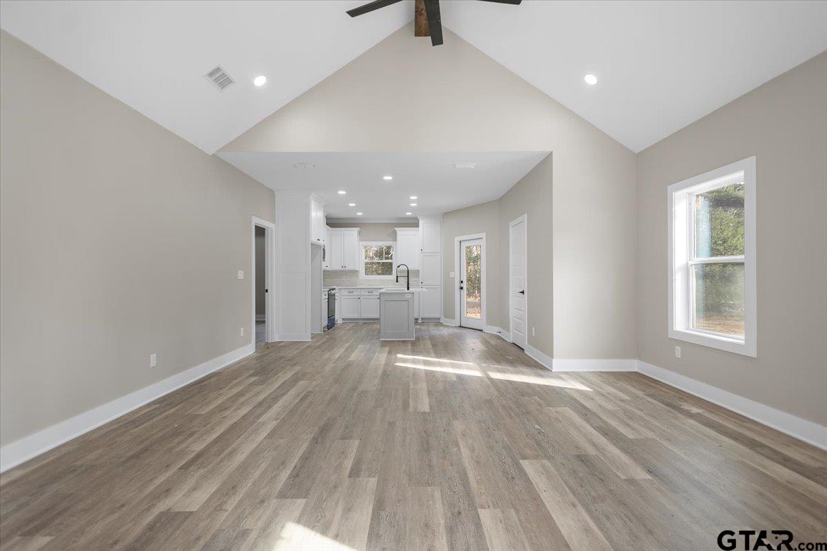 663 Caroline Bend Bullard, TX 75757 - Photo 7 of 36 a view of empty room with wooden floor