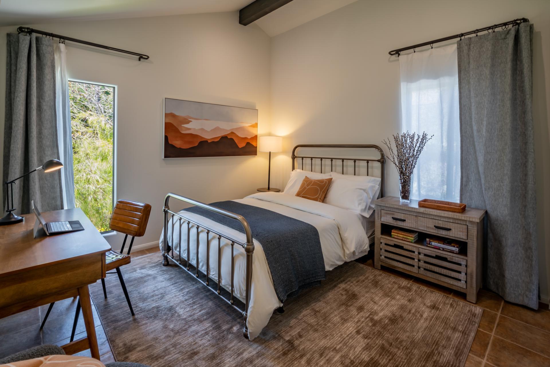 1910 Barker Pass Road Santa Barbara, CA 93108 - Photo 20 of 41 a bedroom with a bed and a dresser next to a window