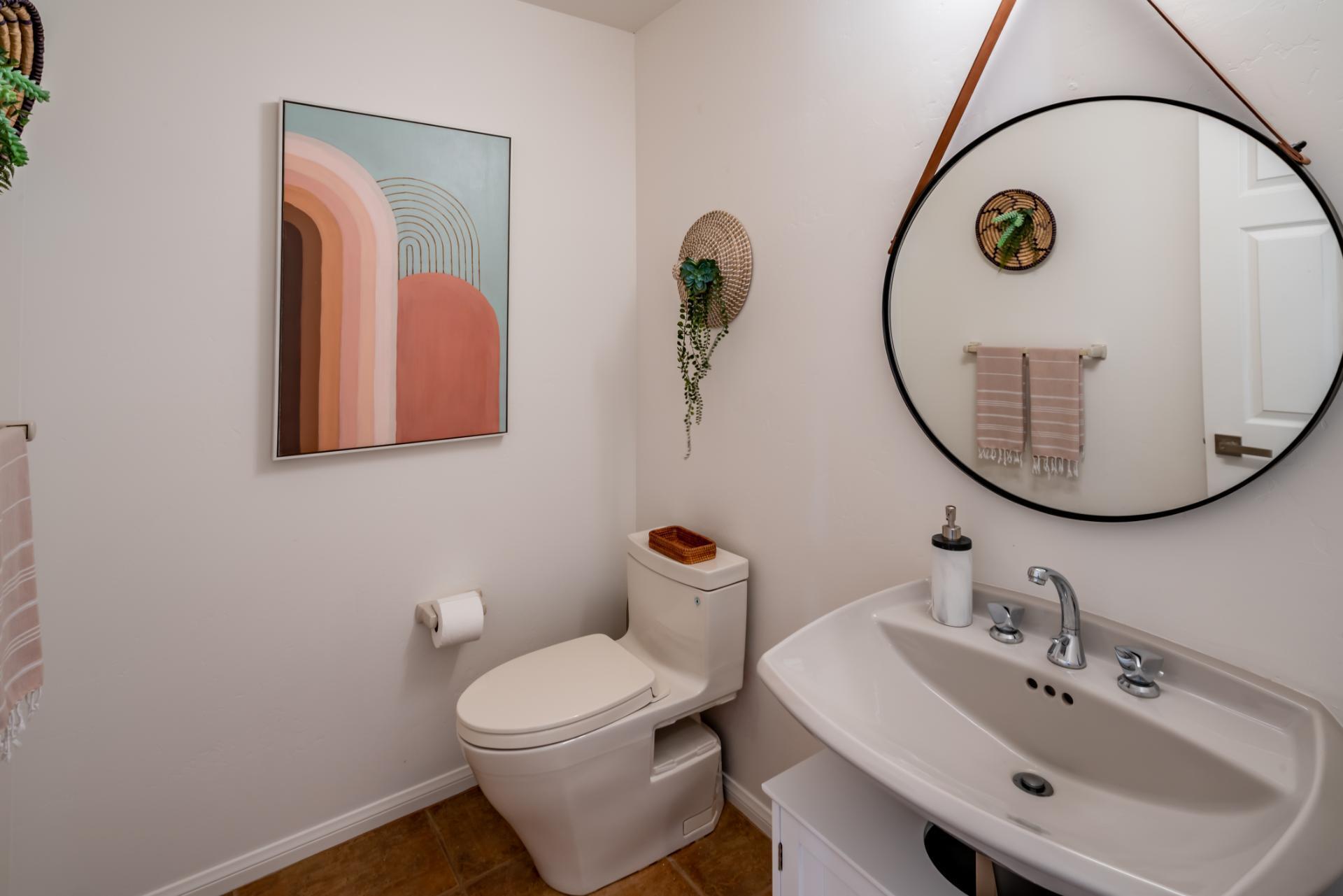 1910 Barker Pass Road Santa Barbara, CA 93108 - Photo 24 of 41 a bathroom with a toilet a sink and mirror
