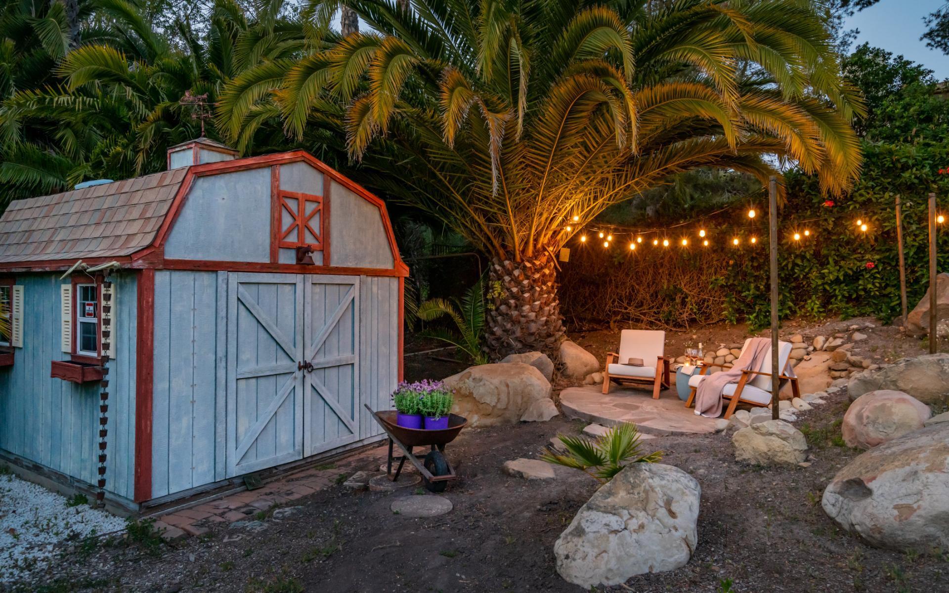 1910 Barker Pass Road Santa Barbara, CA 93108 - Photo 34 of 41 a backyard of a house with table and chairs