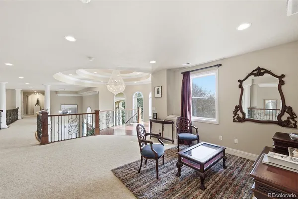 a view of a livingroom with furniture and a window