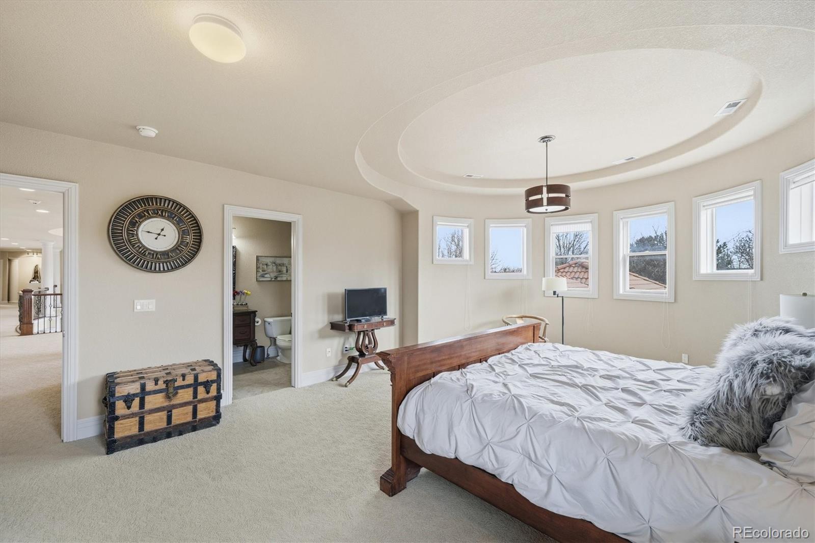 1975 South Lake Road Lakewood, CO 80227 - Photo 22 of 49 a bedroom with a bed a mirror and a desk