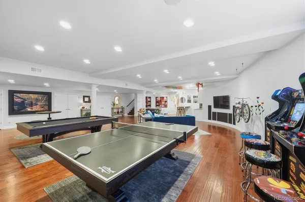 a living room with furniture and a rug