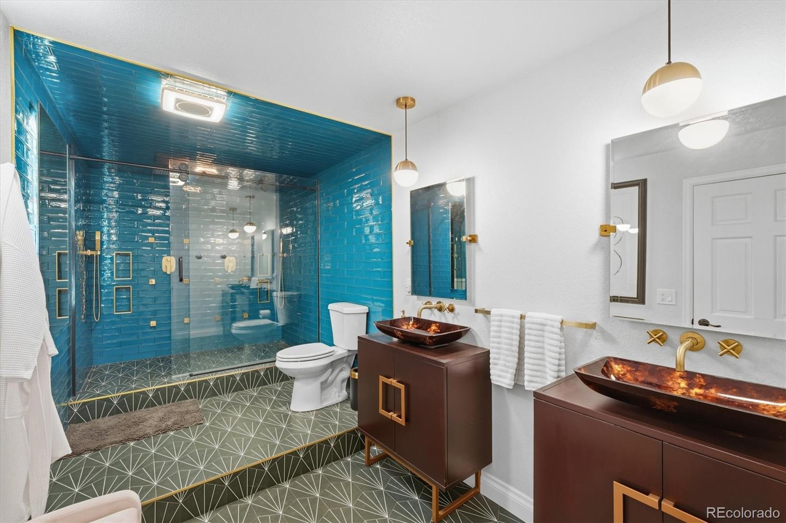1975 South Lake Road Lakewood, CO 80227 - Photo 35 of 49 a bathroom with a sink toilet and shower