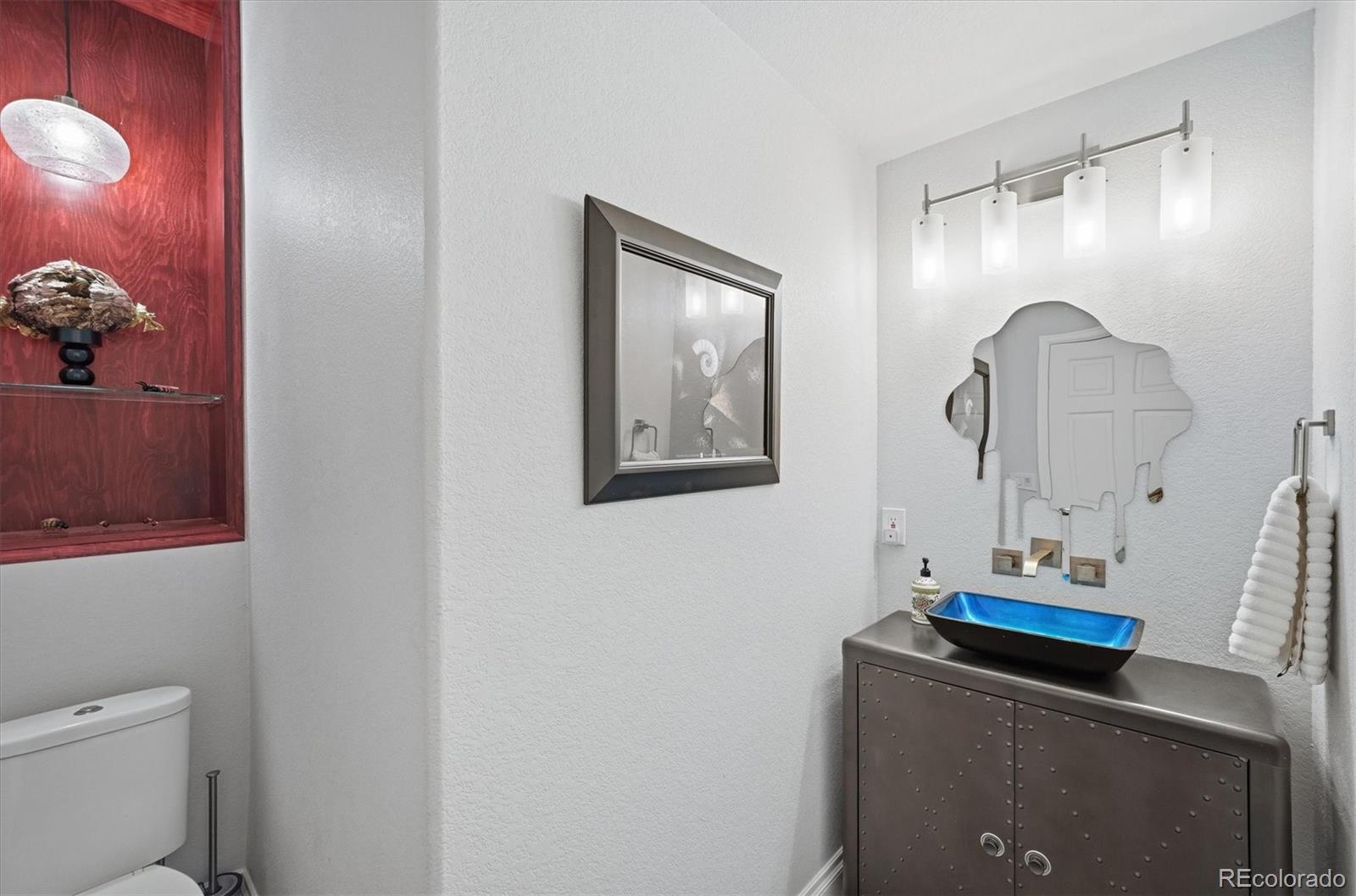 1975 South Lake Road Lakewood, CO 80227 - Photo 37 of 49 a bathroom with a sink and a mirror