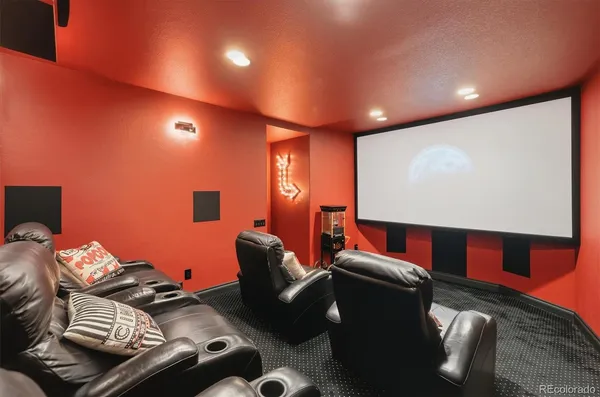 a living room with furniture and a book shelf