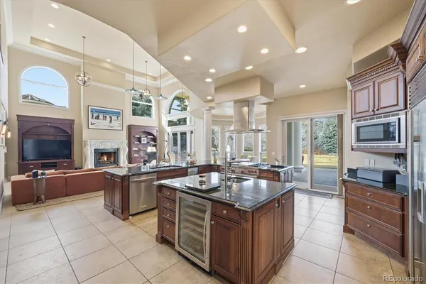 a kitchen with stainless steel appliances granite countertop a stove and a sink