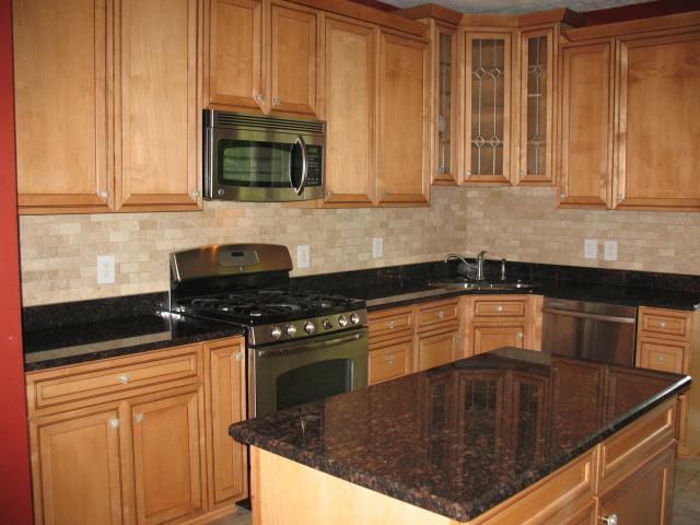 7435 Lebanon Road Mount Juliet, TN 37122 - Photo 4 of 20 Spacious kitchen w/beautiful upgraded Maple w/Chestnut Glaze cabinetry. Granite Counter Tops & Tile back splash! All upgraded stainless appliances remain. Island is moveable!