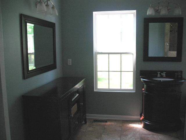7435 Lebanon Road Mount Juliet, TN 37122 - Photo 9 of 20 Master Bath (14X12), Separate HIS & HER custom vanities. Nice tile theme through Master Bath that you will love! Custom Floor Cabinet for Linens & Things!