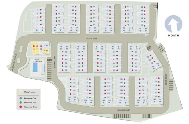 a view of a patio with table and chairs under an umbrella