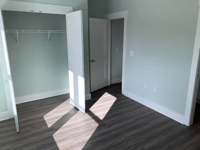 an empty room with wooden floor