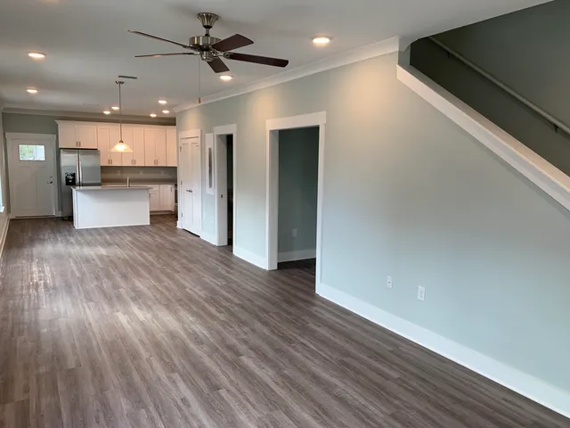 a view of kitchen with cabinets and wooden floor