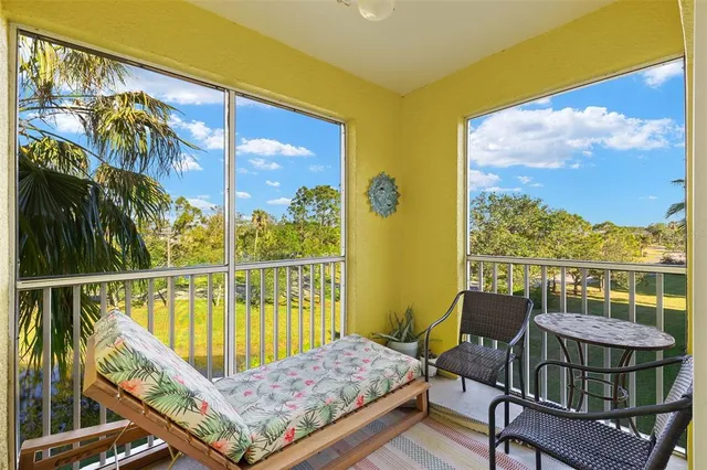 a view of a balcony with furniture