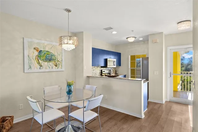 a kitchen with a sink and a stove top oven
