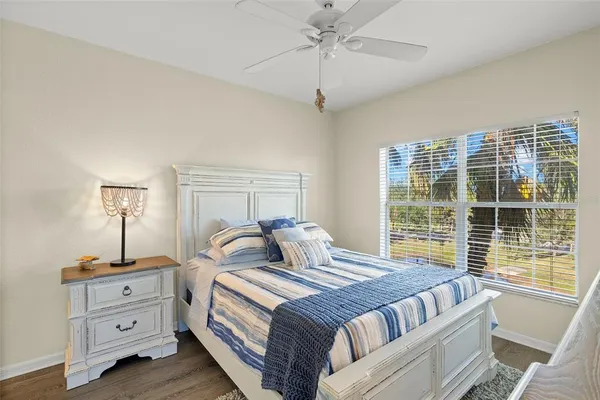 a bedroom with a large bed and a dresser