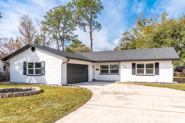 a house with trees in the background