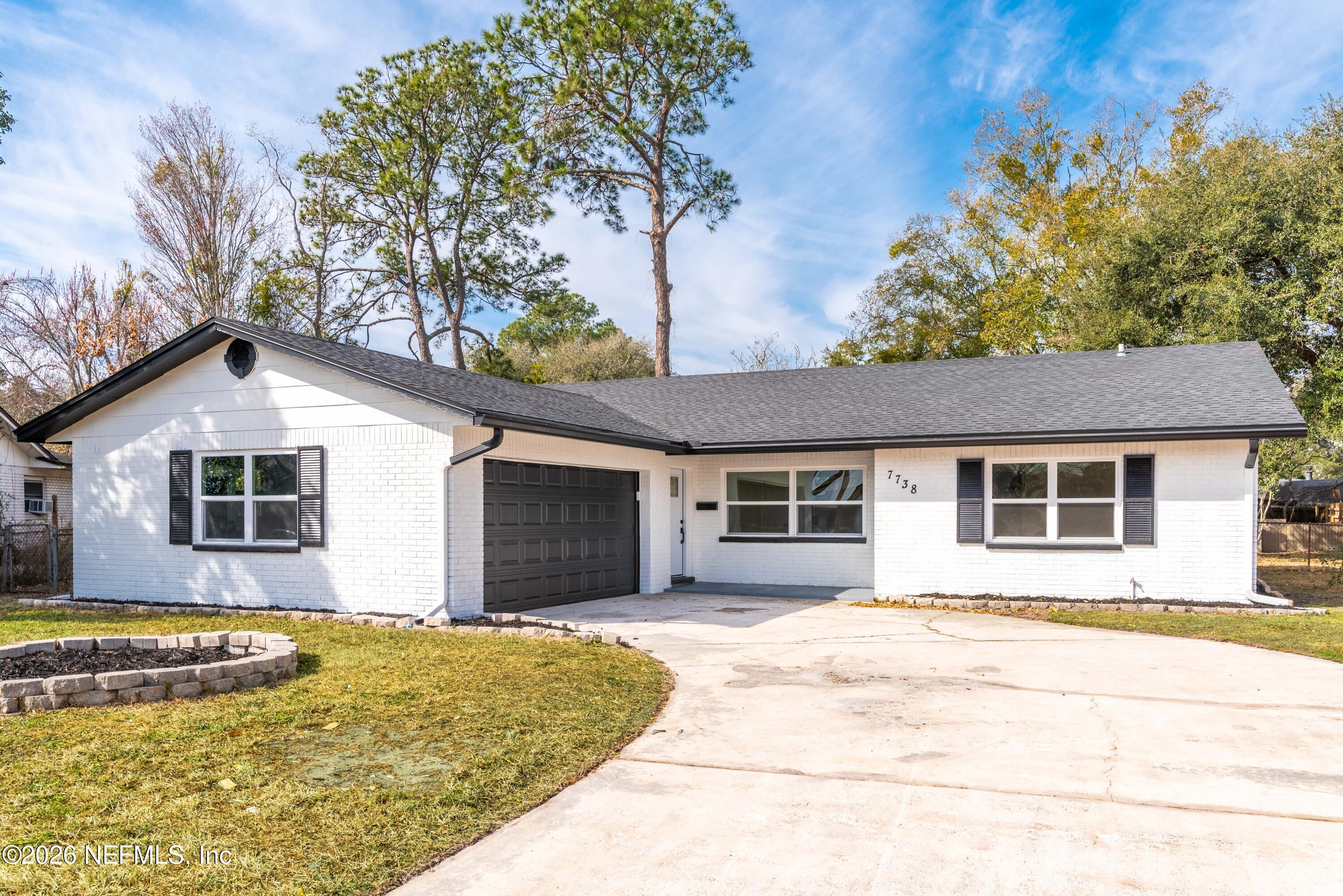 a house with trees in the background