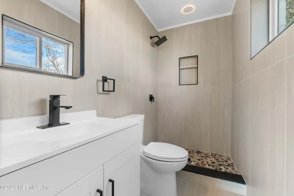 a bathroom with a sink toilet and vanity